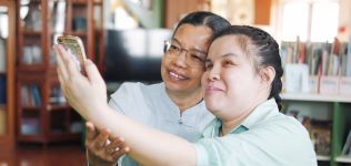 Woman and girl taking selfie