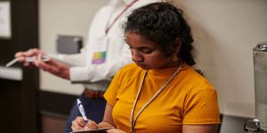 woman taking notes